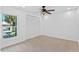 Bedroom featuring a window and closet doors at 604 Desoto Dr, Casselberry, FL 32707