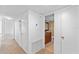 Bright hallway view leading to a bathroom with a dark wood vanity at 604 Desoto Dr, Casselberry, FL 32707