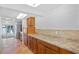Well-appointed kitchen featuring a large countertop, wooden cabinets, and a functional layout for cooking and entertaining at 604 Desoto Dr, Casselberry, FL 32707
