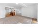 Spacious living room featuring neutral carpet and walls, seamlessly connected to the kitchen and dining areas at 604 Desoto Dr, Casselberry, FL 32707