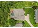 Aerial view of home featuring a screened pool, well-maintained yard, and private driveway at 748 Duff Dr, Winter Garden, FL 34787