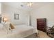 Bedroom featuring a ceiling fan and dark wood dresser with matching rocking chair at 748 Duff Dr, Winter Garden, FL 34787