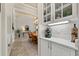 Bright dining room with wood table and chairs, rug, and hutch creates an inviting atmosphere at 748 Duff Dr, Winter Garden, FL 34787