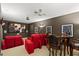 Home theater with tiered seating, movie poster art, and table with bar stools at 748 Duff Dr, Winter Garden, FL 34787