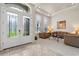 Bright living room with tile floors, neutral walls, and modern furniture at 748 Duff Dr, Winter Garden, FL 34787