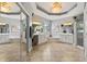The main bathroom boasts dual vanities, tile floors, corner tub, glass shower, and large mirrors at 748 Duff Dr, Winter Garden, FL 34787