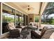 Covered patio with wicker furniture, ceiling fan, and views of the pool area at 748 Duff Dr, Winter Garden, FL 34787