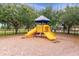 A community playground featuring a play structure with slides and climbing features at 748 Duff Dr, Winter Garden, FL 34787