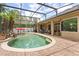 The beautiful pool boasts mature landscaping, spa, a dining area, and room to entertain at 748 Duff Dr, Winter Garden, FL 34787