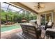 Relaxing screened pool area with waterfall feature, lounge chairs, and lush landscaping at 748 Duff Dr, Winter Garden, FL 34787