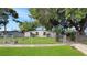 Charming home with a well-maintained lawn and a secure chain-link fence at 7810 Grevillea Dr, Orlando, FL 32822