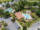 Aerial view of community center, pool, tennis courts, and lush landscaping at 7856 Sugar Bend Dr # 7856, Orlando, FL 32819
