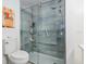 Shower in a modern bathroom with glass door, sleek tiles, and minimalist design at 7856 Sugar Bend Dr # 7856, Orlando, FL 32819