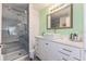 Modern bathroom featuring a glass shower, neutral tones, and a sleek, clean design at 7856 Sugar Bend Dr # 7856, Orlando, FL 32819