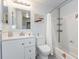 Bathroom featuring a tub and shower combination with a white shower curtain and bright lighting at 7856 Sugar Bend Dr # 7856, Orlando, FL 32819