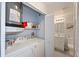 Efficient laundry area with washer, dryer, and storage shelves at 7856 Sugar Bend Dr # 7856, Orlando, FL 32819