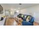 Cozy living room featuring hardwood floors, contemporary furniture, and a seamless flow to the kitchen at 7856 Sugar Bend Dr # 7856, Orlando, FL 32819