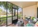 Relaxing screened patio with comfortable seating area at 7856 Sugar Bend Dr # 7856, Orlando, FL 32819