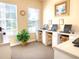 Well-lit business center with computers and seating, perfect for remote work or study at 8023 King Palm Cir, Kissimmee, FL 34747