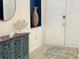 Entryway with decorative console table, white double doors, mirror, and modern light-toned flooring at 8023 King Palm Cir, Kissimmee, FL 34747