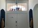 Elegant front door entrance with decorative vases and playful cartoon display above the door at 8023 King Palm Cir, Kissimmee, FL 34747