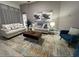 Comfortable living room with neutral walls, plush sofas, and an area rug over modern flooring at 8023 King Palm Cir, Kissimmee, FL 34747