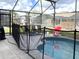 Inviting screened-in pool with lounge chairs and playful decor for outdoor enjoyment and relaxation at 8023 King Palm Cir, Kissimmee, FL 34747