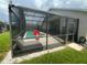 Enclosed pool area including a lounge chair with view of the refreshing pool at 8023 King Palm Cir, Kissimmee, FL 34747