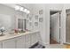 Bathroom features double vanity and decorative mirrors at 8852 Fort Jefferson Blvd, Orlando, FL 32822