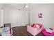 Bright bedroom featuring a toddler bed, and an adjacent playroom at 8852 Fort Jefferson Blvd, Orlando, FL 32822