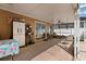 View of the covered patio with furniture and sliding glass doors to the interior at 8852 Fort Jefferson Blvd, Orlando, FL 32822