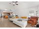 Bright living room featuring tile flooring, a ceiling fan, and a white sectional sofa at 8852 Fort Jefferson Blvd, Orlando, FL 32822