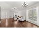 Bright living room with hardwood floors, neutral décor, and large windows at 8852 Fort Jefferson Blvd, Orlando, FL 32822
