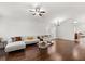Spacious living room with gleaming hardwood floors, neutral paint, and ample natural light at 8852 Fort Jefferson Blvd, Orlando, FL 32822