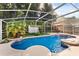 A beautiful pool with screened enclosure, mature trees, and a fenced-in backyard at 8852 Fort Jefferson Blvd, Orlando, FL 32822