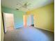 Bedroom with a ceiling fan, carpet, and a closet at 8929 Legacy Ct # 208, Kissimmee, FL 34747