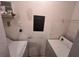 Compact laundry room with washer, dryer, and utility panel at 8929 Legacy Ct # 208, Kissimmee, FL 34747
