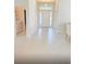 Inviting entryway with a spacious tile floor, leading to a bright, modern home at 1168 Citrus Landings Blvd, Davenport, FL 33837