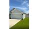 Charming single Gathering home featuring a two car garage, well maintained lawn, and welcoming front entrance at 1168 Citrus Landings Blvd, Davenport, FL 33837
