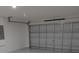 Spacious garage with automatic door, offering ample parking and storage space for vehicles and equipment at 1168 Citrus Landings Blvd, Davenport, FL 33837