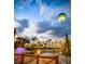 Hot air balloon over a lagoon with a bridge and palm trees at 1168 Citrus Landings Blvd, Davenport, FL 33837