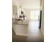 Modern kitchen featuring granite countertops, white cabinets, and stainless steel appliances for a sleek look at 1168 Citrus Landings Blvd, Davenport, FL 33837