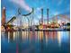 Vibrant amusement park with roller coasters, rides, and attractions reflected in the water at 1168 Citrus Landings Blvd, Davenport, FL 33837