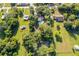 Sprawling property showcasing a home with a pool surrounded by lush greenery and mature trees at 1206 Culver Rd, Orlando, FL 32825