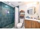 Stylish bathroom with a tiled shower, modern vanity, and sleek fixtures at 1206 Culver Rd, Orlando, FL 32825