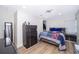 Comfortable bedroom features wood-look flooring, closet, and neutral color scheme at 1206 Culver Rd, Orlando, FL 32825