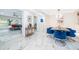 Dining room with marble floors, modern lighting, and adjacent living room area at 1206 Culver Rd, Orlando, FL 32825