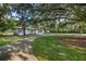 Well-maintained home with a long driveway leading to the front entrance, surrounded by mature landscaping and trees at 1206 Culver Rd, Orlando, FL 32825
