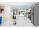 Modern kitchen with a large island, stainless steel appliances, and beautiful marble countertops at 1206 Culver Rd, Orlando, FL 32825