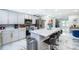 Bright, renovated kitchen features marble countertops, stainless appliances, and breakfast bar seating at 1206 Culver Rd, Orlando, FL 32825